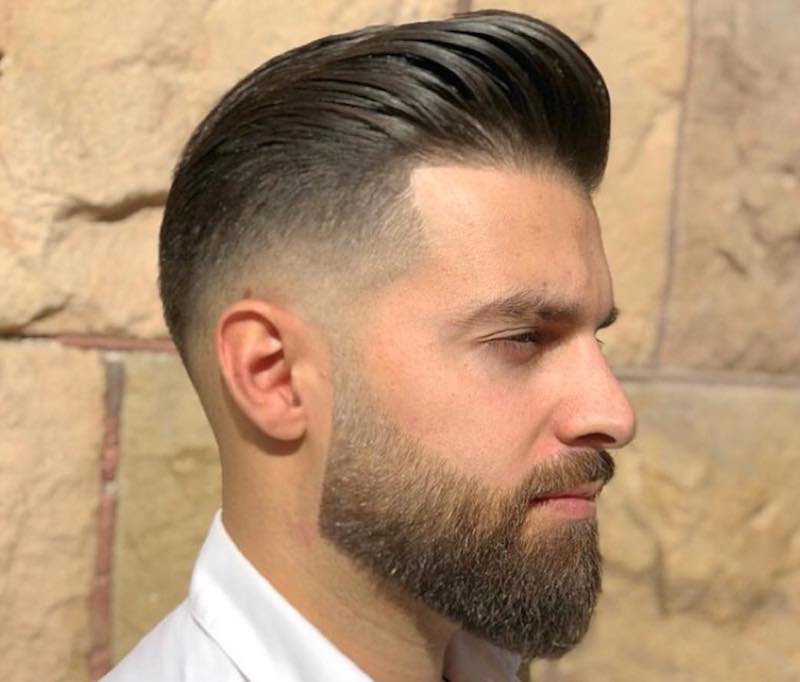 Men's hair cut shaved on the sides and shaded, worn backwards